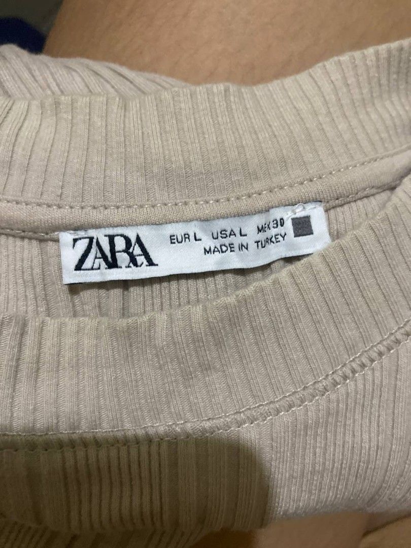 ZARA ribbed sleeveless tank top (Category: Sleeveless) located in Liloan. Submitted by jonahmayaa (Listing ID 1453719679, Image 2). Description: - FREE if you buy 1 ITEM - preloved - stretchy - size: large on tag rfs: decluttering location: liloan, cebu mop: gcash/maribank mod: j&t ( sf shouldered by buyer) meet up: sm city cebu.