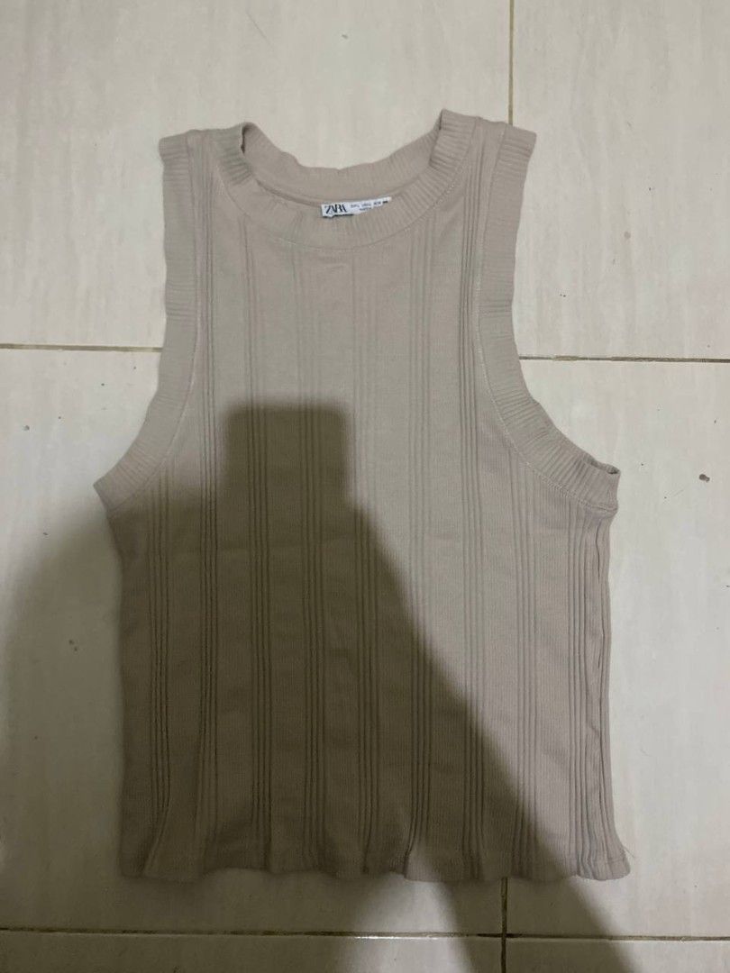 ZARA ribbed sleeveless tank top (Category: Sleeveless) located in Liloan. Submitted by jonahmayaa (Listing ID 1453719679, Image 1). Description: - FREE if you buy 1 ITEM - preloved - stretchy - size: large on tag rfs: decluttering location: liloan, cebu mop: gcash/maribank mod: j&t ( sf shouldered by buyer) meet up: sm city cebu.