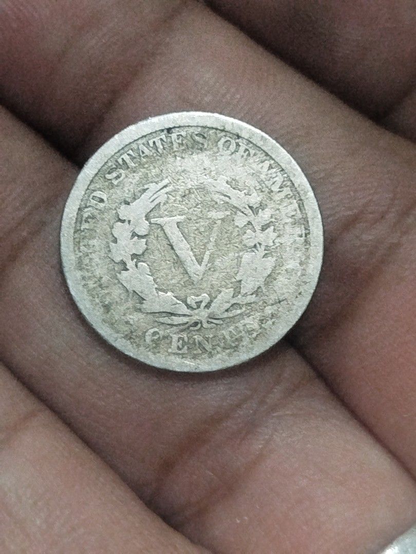 1897 US Liberty V Nickel Coin (Category: Currency) located in Subic. Submitted by regiedaniel01 (Listing ID 1453815340, Image 2). Description: - Authentic 1897 United States V Nickel coin. - Features the iconic Lady Liberty on the obverse. - Reverse displays a distinctive wreath with a large 'V'. - A classic and valuable addition to any coin collection. - Perfect for numismatists and history enthusiasts..