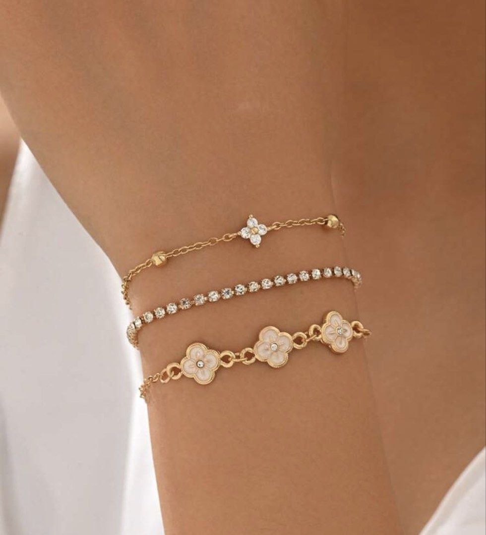3pc Rose Gold Clover & Crystal Bracelet Set (Category: Bracelets) located in Manila. Submitted by decluterthings888 (Listing ID 1453868347, Image 3). Description: - Set of 3 bracelets - Delicate chain with crystal charm - Tennis bracelet with clear stones - Rose gold clover charms with white enamel - Adjustable clasps - Perfect for layering or wearing separately.