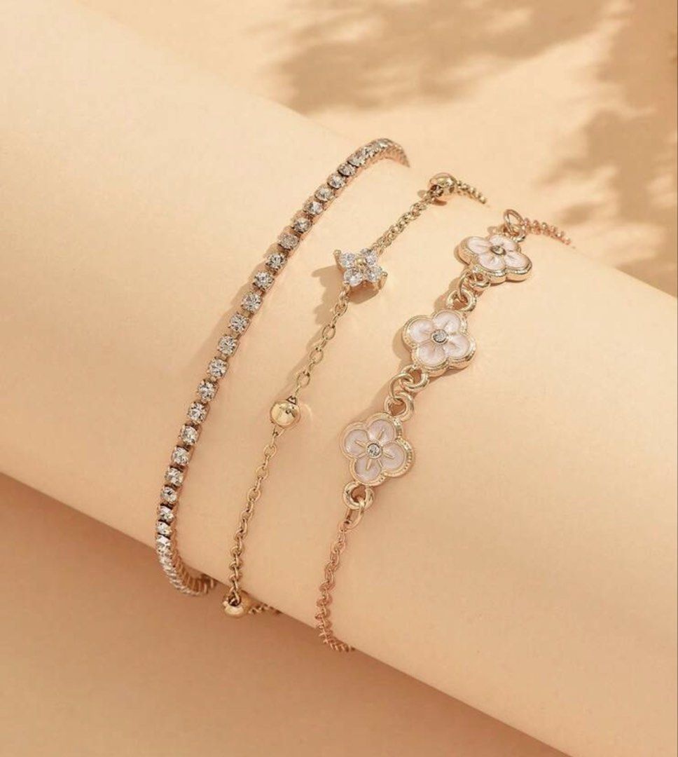 3pc Rose Gold Clover & Crystal Bracelet Set (Category: Bracelets) located in Manila. Submitted by decluterthings888 (Listing ID 1453868347, Image 2). Description: - Set of 3 bracelets - Delicate chain with crystal charm - Tennis bracelet with clear stones - Rose gold clover charms with white enamel - Adjustable clasps - Perfect for layering or wearing separately.