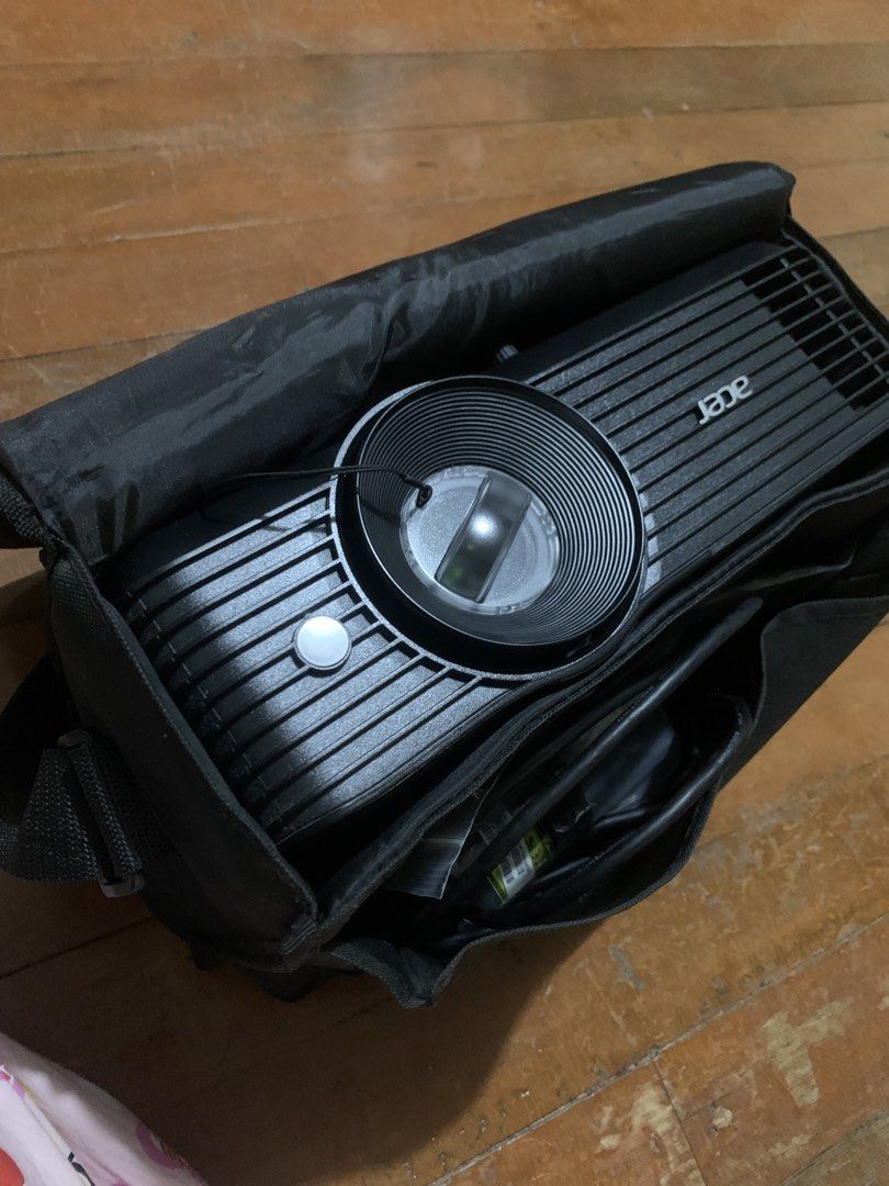 Acer Projector with Bag and Accessories (Category: Projectors) located in Manila. Submitted by camrica (Listing ID 1453947251, Image 1). Description: bought back in 2024 but barely used, so it still feels new - Acer projector for sale - Includes original carrying bag - All original accessories included: remote, power cable, VGA cable, and other cables shown - Tested and confirmed working - Ideal for presentations or home theater setup.