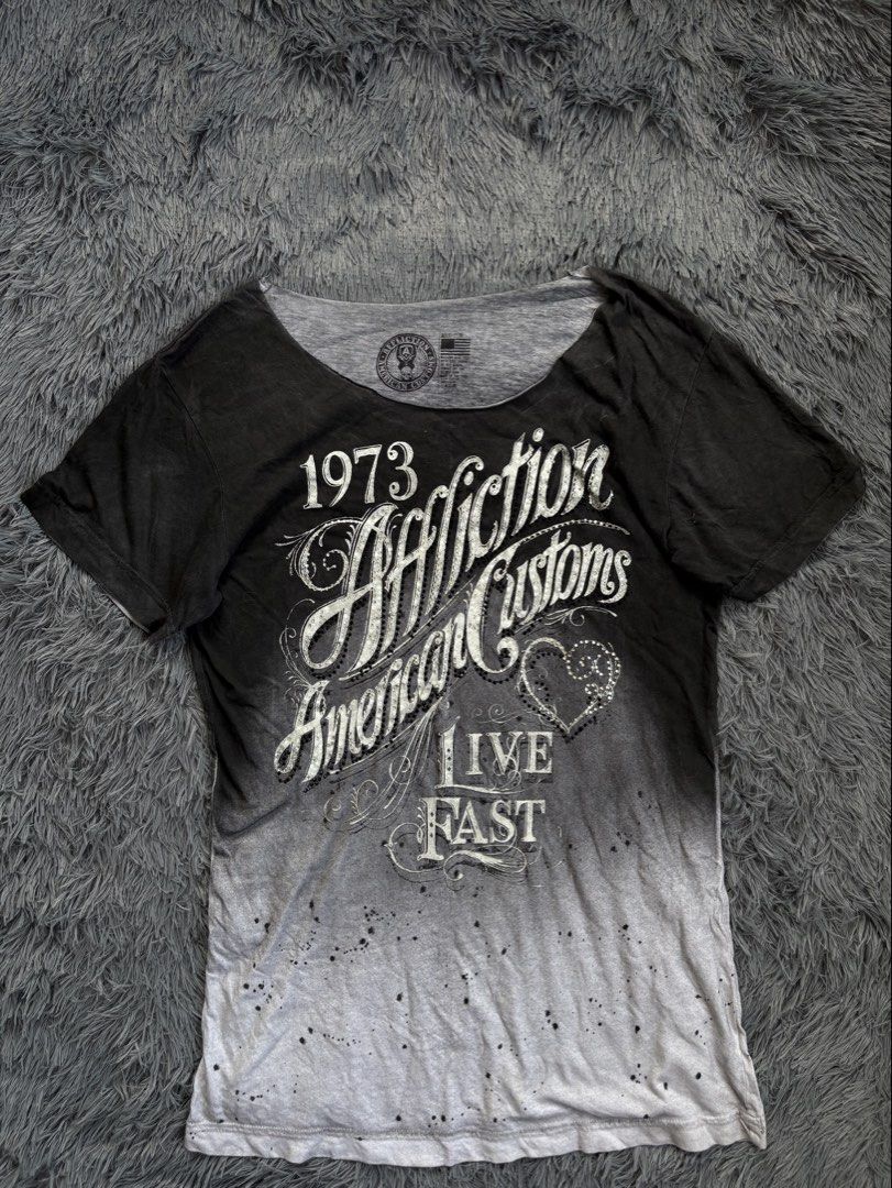 Affliction American Customs T-shirt (Category: Others Tops) located in Manila. Submitted by 3ftkl2 (Listing ID 1453855417, Image 1). Description: Size on tag: M Width: 17.50” Length: 27” Condition: Very Good Issue: Need wash / Slight yellow stain Color rate: 10/10 Note: Color may vary due to lighting. 349 + shipping none negotiable. DM us for more inquiries..