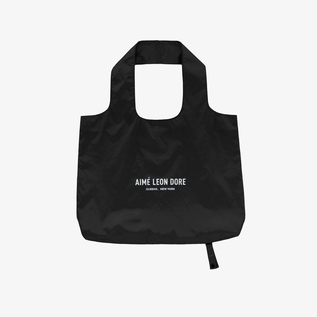 AIMÉ LEON DORE Black Packable Tote (Category: Belt bags, Clutches and Pouches) located in Makati City. Submitted by 29angelo (Listing ID 1453994011, Image 1). Description: - Brand: AIMÉ LEON DORE - Color: Black - Style: Reusable packable shopping tote bag - Features: 'Queens, New York' printed on the front - Practicality: very easy to fold and carry. Quite big too! - Ideal as an extra tote for everyday in your bag or when you travel. - ETA: End o