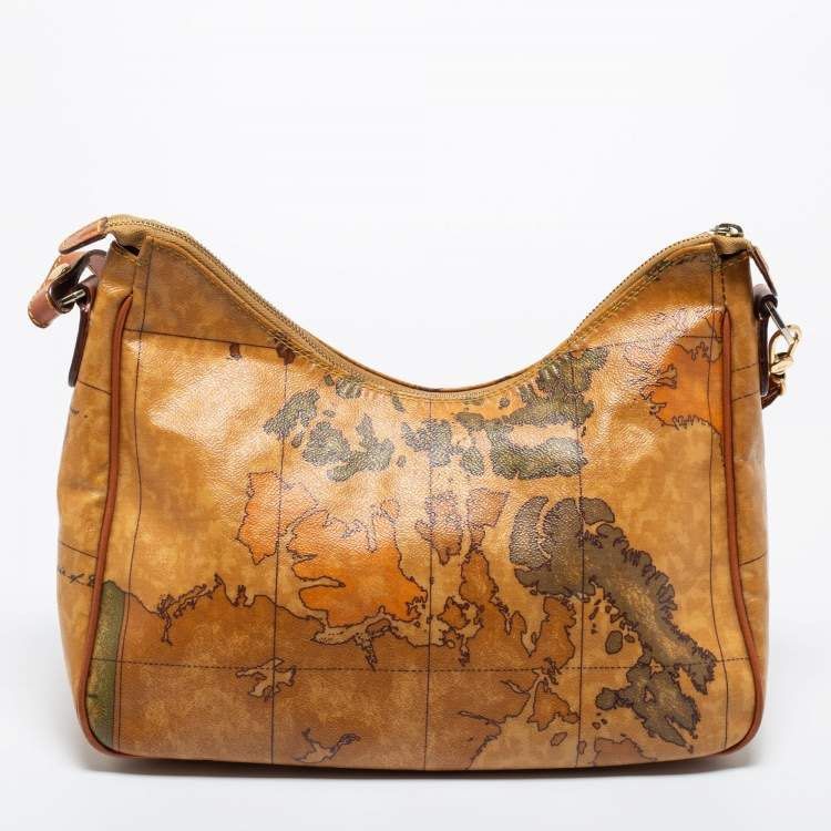 Alviero Martini 1a Classe Geo Map Shoulder Bag (Category: Luxury Bags & Wallets) located in Dipolog. Submitted by adrian281994 (Listing ID 1453865352, Image 2). Description: - Iconic Alviero Martini map print - Tan leather trim - Zipper closure - Adjustable strap - Ideal for travel or everyday use - Shows some signs of wear, but plenty of life left - Unique and eye-catching design.