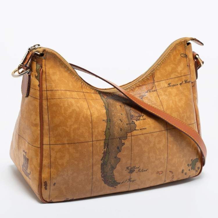 Alviero Martini 1a Classe Geo Map Shoulder Bag (Category: Luxury Bags & Wallets) located in Dipolog. Submitted by adrian281994 (Listing ID 1453865352, Image 1). Description: - Iconic Alviero Martini map print - Tan leather trim - Zipper closure - Adjustable strap - Ideal for travel or everyday use - Shows some signs of wear, but plenty of life left - Unique and eye-catching design.