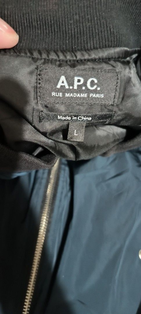 A.P.C. Rue Madame Paris Bomber Jacket Size L (Category: Coats, Jackets and Outerwear) located in Manila. Submitted by itsmelawrence (Listing ID 1453976901, Image 2). Description: - Dark teal A.P.C. bomber jacket - YKK zipper closure - Zippered pocket on sleeve - Ribbed collar, cuffs, and hem - Material: 100% Polyester (Shell, Lining, Padding, Sleeve Lining) - Ribbing: 95% Polyester, 5% Elastane - Made in China - Care instructions on tag awitan mo