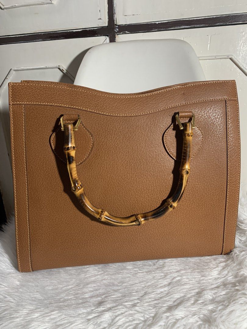 Authentic Gucci Diana Handbag (Category: Luxury Bags & Wallets) located in Pasig City. Submitted by wandererme (Listing ID 1453935956, Image 1). Description: - Classic brown leather handbag - Unique bamboo handle - Structured shape, ideal for everyday use - Spacious interior, flaws: powdery but cleaned already - Beautiful textured leather finish - A timeless, versatile piece - 💯Authentic Gucci Diana Bamboo Handbag includes - DM for the price.
