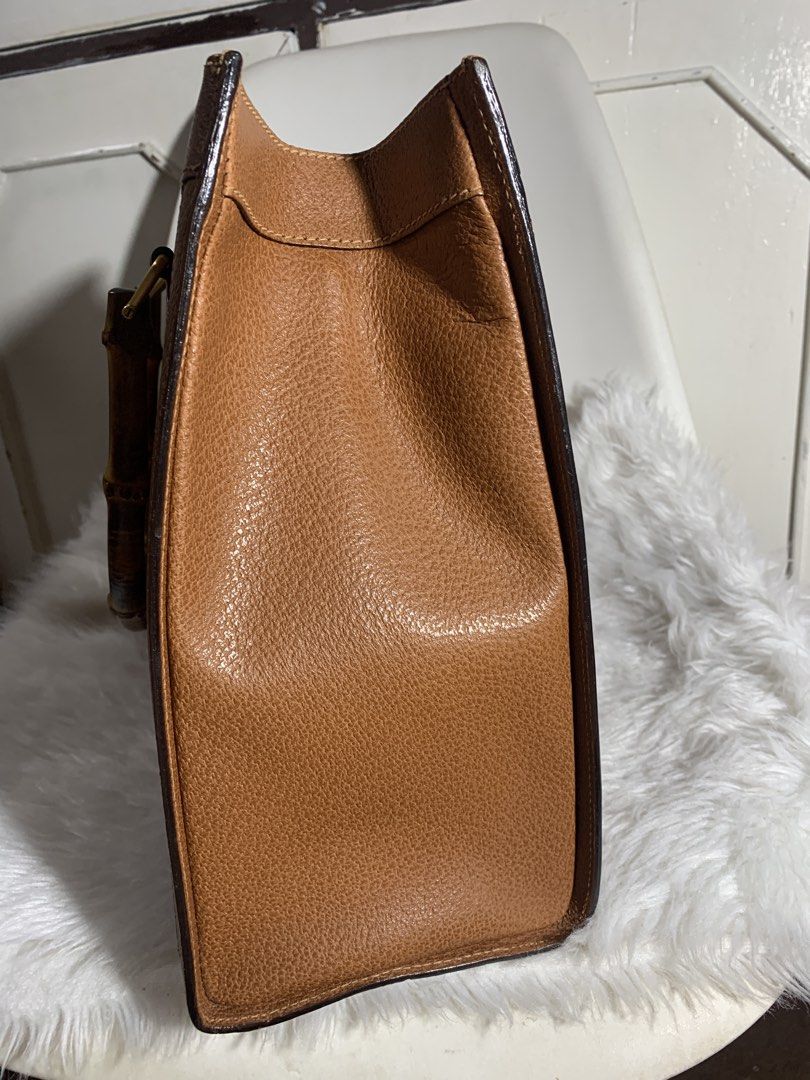 Authentic Gucci Diana Handbag (Category: Luxury Bags & Wallets) located in Pasig City. Submitted by wandererme (Listing ID 1453935956, Image 3). Description: - Classic brown leather handbag - Unique bamboo handle - Structured shape, ideal for everyday use - Spacious interior, flaws: powdery but cleaned already - Beautiful textured leather finish - A timeless, versatile piece - 💯Authentic Gucci Diana Bamboo Handbag includes - DM for the price.