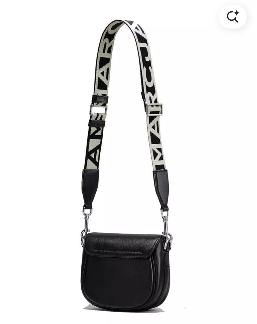 Authentic Marc Jacobs The J Marc Small Saddle Bag Black (Category: Luxury Bags & Wallets) located in Manila. Submitted by luxestuffph (Listing ID 1453905951, Image 3). Description: - Authentic Black Marc Jacobs saddle bag - Features the iconic J Marc logo on the front - Comes with a detachable strap.