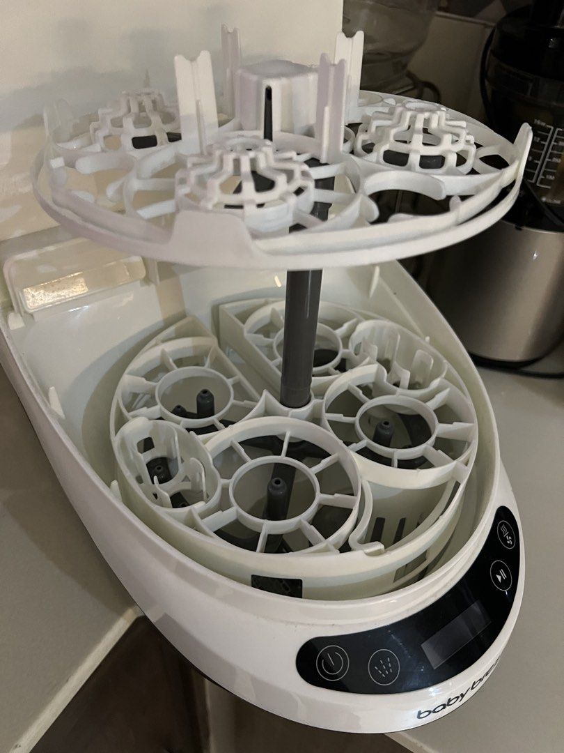 Baby Breeza bottle washer (Category: Breastfeeding & Bottle Feeding) located in Makati City. Submitted by hello.declutter.me (Listing ID 1453825119, Image 2). Description: Comes with dishwasher tablets.