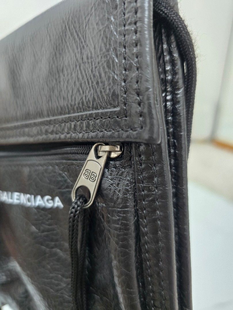 Balenciaga Black Leather Wallet with Strap (Category: Luxury Bags & Wallets) located in Las Pinas. Submitted by vanpru (Listing ID 1453996539, Image 3). Description: - Authentic Balenciaga black leather wallet - Features a secure zip pocket and convenient card slots - Comes with a versatile long strap for crossbody or neck wear - Perfect for carrying your essentials on the go.