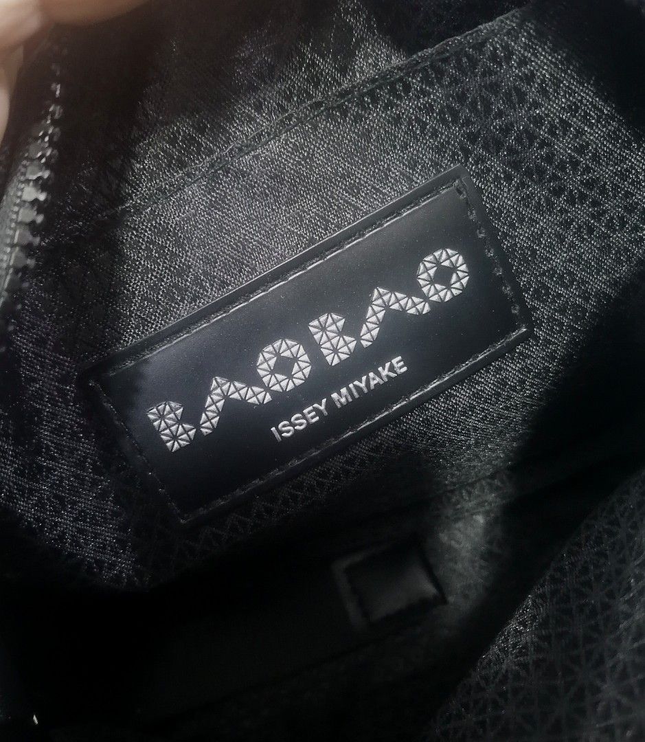 BAO BAO ISSEY MIYAKE Black Geometric Crossbody Bag (Category: Cross-body Bags) located in Cebu City. Submitted by roadthrift (Listing ID 1453853708, Image 3). Description: - Authentic BAO BAO ISSEY MIYAKE crossbody bag - Unique geometric design - Made in Japan - Materials: PVC vinyl chloride, polyester, nylon, synthetic leather - Zipper closure - Adjustable strap - Ideal for everyday use.
