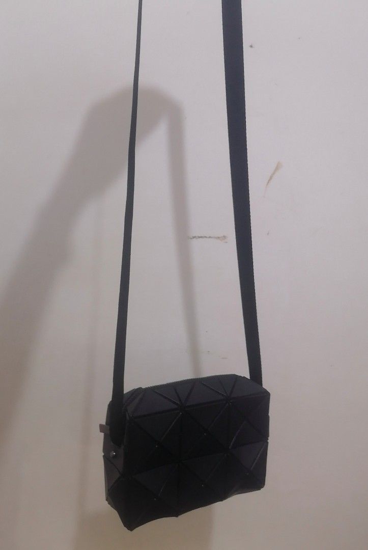 BAO BAO ISSEY MIYAKE Black Geometric Crossbody Bag (Category: Cross-body Bags) located in Cebu City. Submitted by roadthrift (Listing ID 1453853708, Image 2). Description: - Authentic BAO BAO ISSEY MIYAKE crossbody bag - Unique geometric design - Made in Japan - Materials: PVC vinyl chloride, polyester, nylon, synthetic leather - Zipper closure - Adjustable strap - Ideal for everyday use.