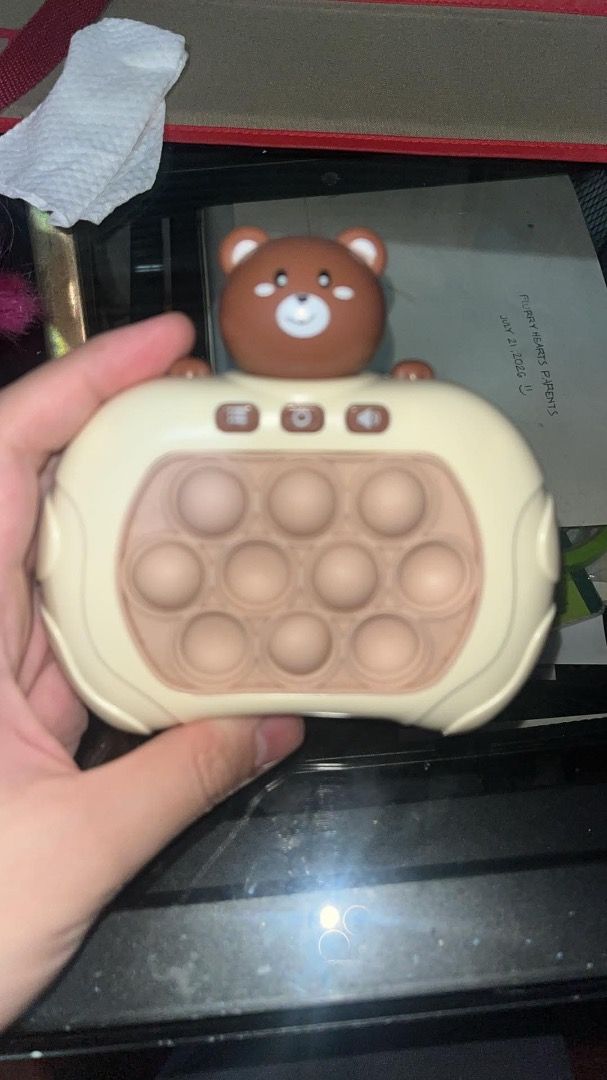 Bear Fidget Toy with Pop It Buttons (Category: Interactive Toys) located in Los Banos. Submitted by the_shining_armor (Listing ID 1453982114, Image 3). Description: - Adorable bear-shaped fidget toy - Features pop-it style buttons on the front - Includes additional buttons on the sides - Likely requires batteries (not included) - Perfect for stress relief and sensory play - Suitable for both children and adults FLAWS - yung dalawa po nyang button