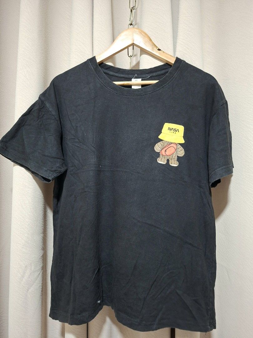 Black NASA Like Graphic T-Shirt (Category: Tshirts & Polo Shirts ) located in Batangas. Submitted by sell_ph (Listing ID 1453932248, Image 2). Description: - Black t-shirt with a cool graphic on the back. - Features a teddy bear wearing a yellow bucket hat and a fanny pack. - The bucket hat has 'NASA LIKE' printed on it. - Perfect for casual everyday wear..