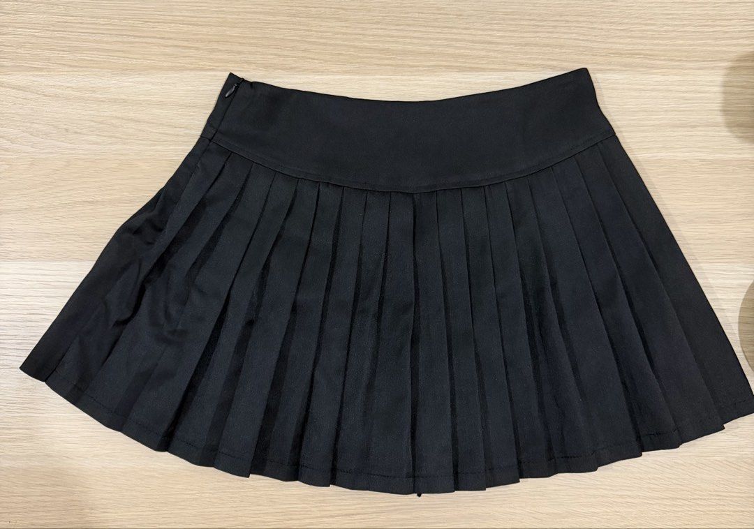 Black pleated skirt (Category: Skirts) located in Makati City. Submitted by declutterwithella (Listing ID 1453872706, Image 1). Description: Brand: Riya Fashion from TikTok Size: XL, fits 28-29 Color: Black No flaws.