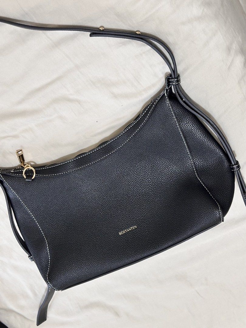 BOSTANTEN Black Leather Shoulder Bag (Category: Shoulder Bags) located in Taguig. Submitted by mandms09 (Listing ID 1453889165, Image 1). Description: Price negotiable! RFS: decluttering No rush please - Black pebbled leather shoulder bag - White contrast stitching - Gold hardware details - Zipper closure - Adjustable strap - Simple and classic design - Great for everyday use.