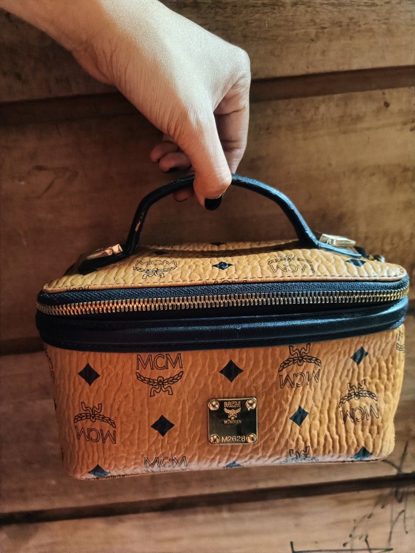 Bundled MCM Monogram Vanity Case with Studded Clutch (Category: Luxury Bags & Wallets) located in Cebu City. Submitted by elen30abalo (Listing ID 1442790941, Image 1). Description: - vintage MCM vanity case - Signature MCM monogram print - Spacious interior for all your essentials - Comes with a detachable crossbody strap - Includes a separate studded clutch bag - Both pieces offer a chic vintage aesthetic - Ideal for organization or as a fashion