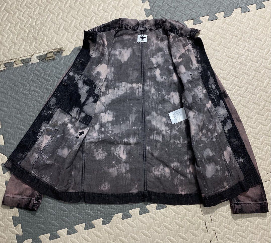 CHRISTIAN DIOR Bee Embroidered Tie-Dye Work Jacket❗️ (Category: Luxury Apparel) located in Cebu City. Submitted by darl.g (Listing ID 1453951909, Image 2). Description: •CHRISTIAN DIOR Bee Embroidered Tie-Dye Work Jacket❗️ •Authentic Dior work jacket •Unique tie-dye pattern •Iconic bee embroidery on chest pocket •Button-up front closure • Multiple functional pockets •Ideal for layering over outfits •SMALL up to MEDIUM fits Width -18 Length -24 Ex