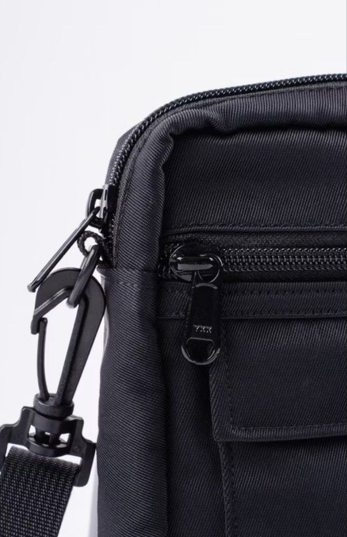 Daily Grind Black Crossbody Bag (Category: Sling Bags) located in Plaridel. Submitted by julien_stuff (Listing ID 1453981073, Image 3). Description: - Brand: Daily Grind - Color: Black - Style: Crossbody bag - Main compartment: Zippered - Front pockets: 1 velcro closure, 1 zippered - Zippers: YKK - Strap: Adjustable - Ideal for: Everyday use.