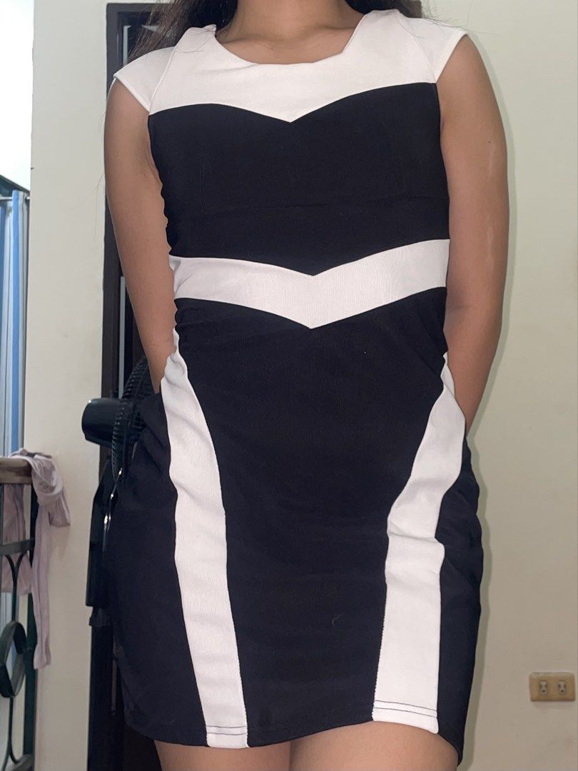 Elegant Bodycon Dress (Category: Dresses) located in Manila. Submitted by declutteredbyalex (Listing ID 1453949507, Image 3). Description: - Black and white sleeveless bodycon dress features a chevron-inspired contrast pattern. - In very good condition! - Fabric is thick and high quality and does not feel makati or mainit on the skin - Perfect for your office siren outfits or office events! RFS: Decluttering.