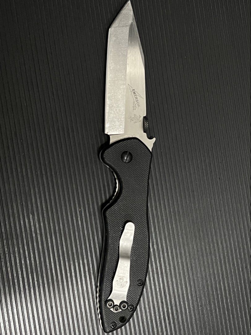 Emerson Kershaw Folding Knife - Black Handle (Category: Hiking & Camping) located in Cebu City. Submitted by zershrovv (Listing ID 1453910811, Image 1). Description: - Emerson folding knife - Black textured handle - Silver blade with sharp point - Pocket clip attached - Ideal for everyday carry (EDC) - Blade shows minor scuffs.