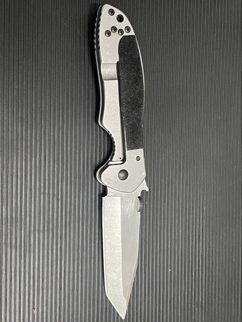 Emerson Kershaw Folding Knife - Black Handle (Category: Hiking & Camping) located in Cebu City. Submitted by zershrovv (Listing ID 1453910811, Image 2). Description: - Emerson folding knife - Black textured handle - Silver blade with sharp point - Pocket clip attached - Ideal for everyday carry (EDC) - Blade shows minor scuffs.