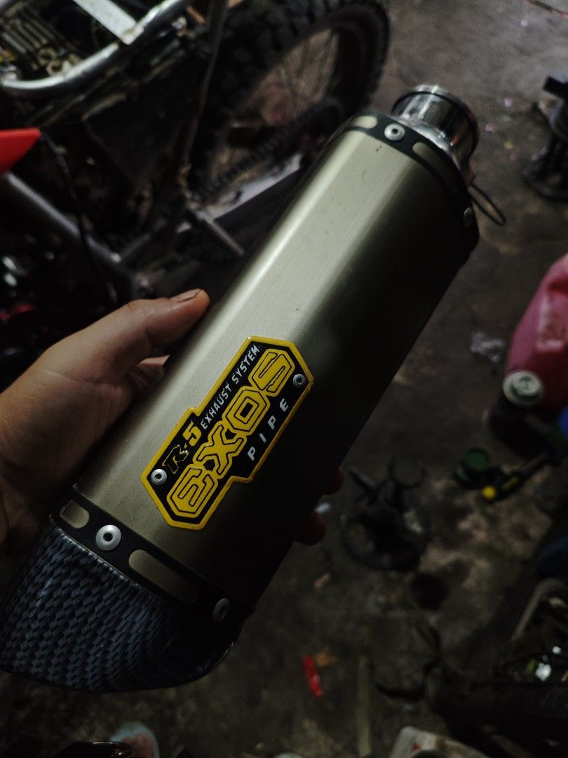 EXOS Exhaust System Pipe for Motorcycle (Category: Construction & Building Materials) located in Bagabag. Submitted by maktzy (Listing ID 1454000248, Image 1). Description: - EXOS r5 v2 exhaust pipe for motorcycles - Stylish gold and carbon fiber look - Ready for its next owner - Message for more details - pwede ko pa ship through Flash Express or J&T express.nagamit lng nuon ng 1 month..