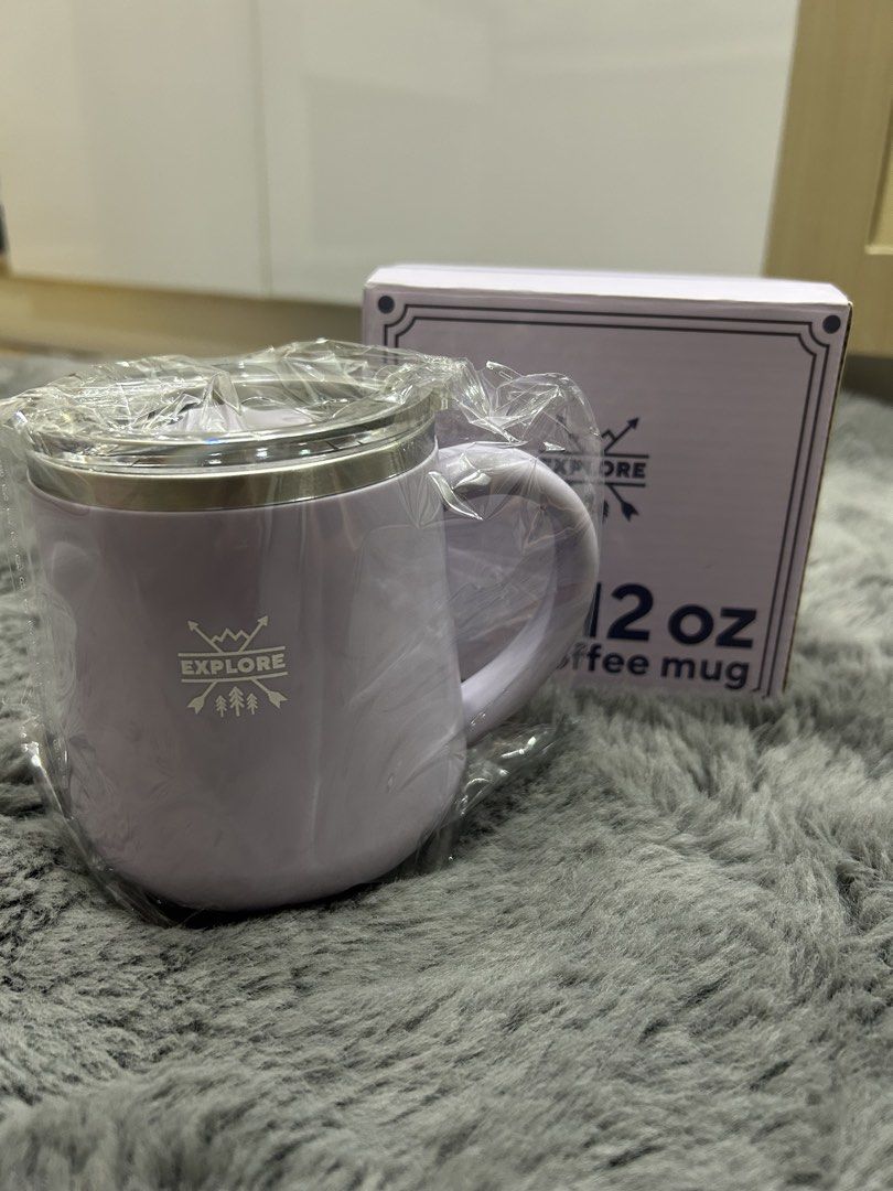 Explore 12 oz Coffee Mug (Category: Coffee & Tea Tableware) located in Cebu City. Submitted by hazel19472812 (Listing ID 1453962513, Image 1). Description: - Light purple coffee mug - Features 'Explore' logo - Includes a lid - Comes with original box - Ideal for morning coffee or tea - Perfect companion for your adventures.