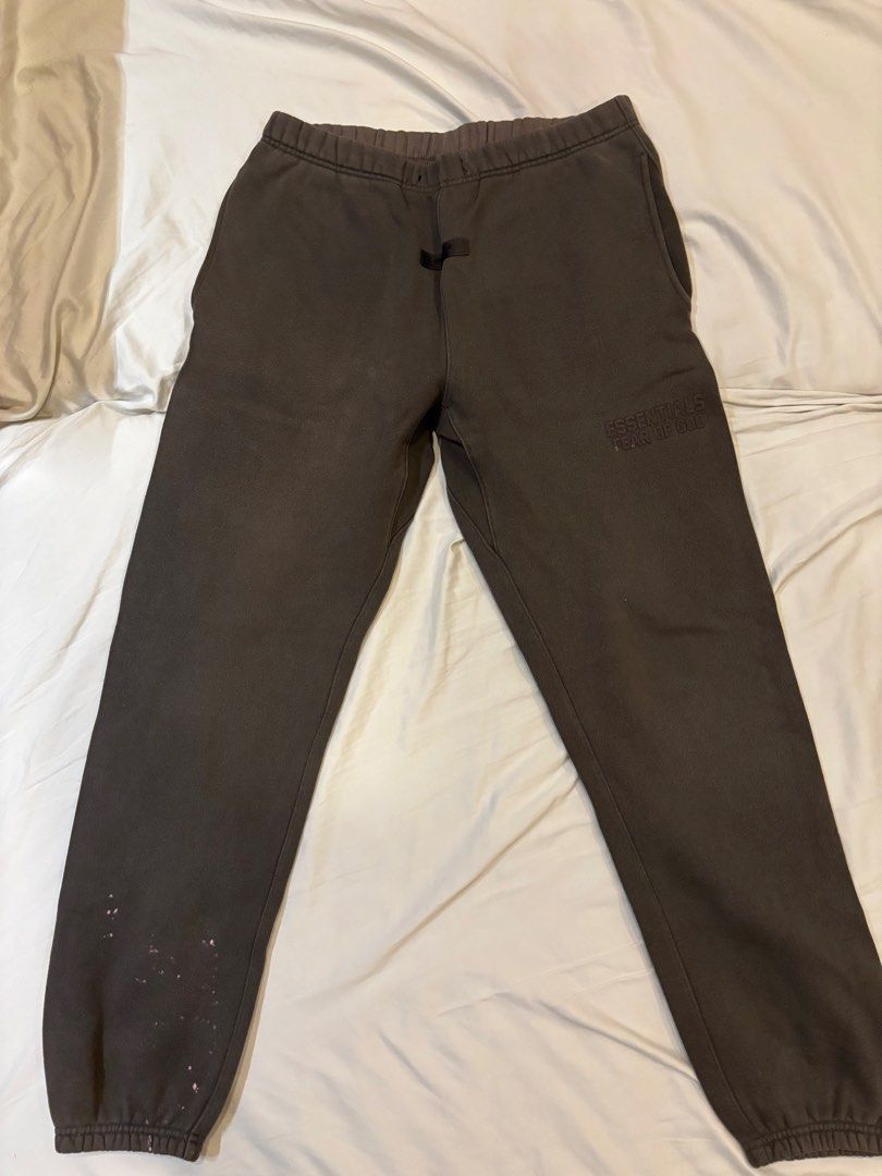 Fear of God Essentials Sweatpants Size M (Category: Joggers) located in Manila. Submitted by zxcvbnm_100 (Listing ID 1453974931, Image 1). Description: - Brand: Fear of God Essentials - Color: Brown - Size: Medium (M) - Features: Printed Essentials logo on leg, elastic waistband with drawstring - Condition: Minor marks on the left leg near the ankle - Origin: Made in Vietnam Bought in Commonwealth Rockwell.