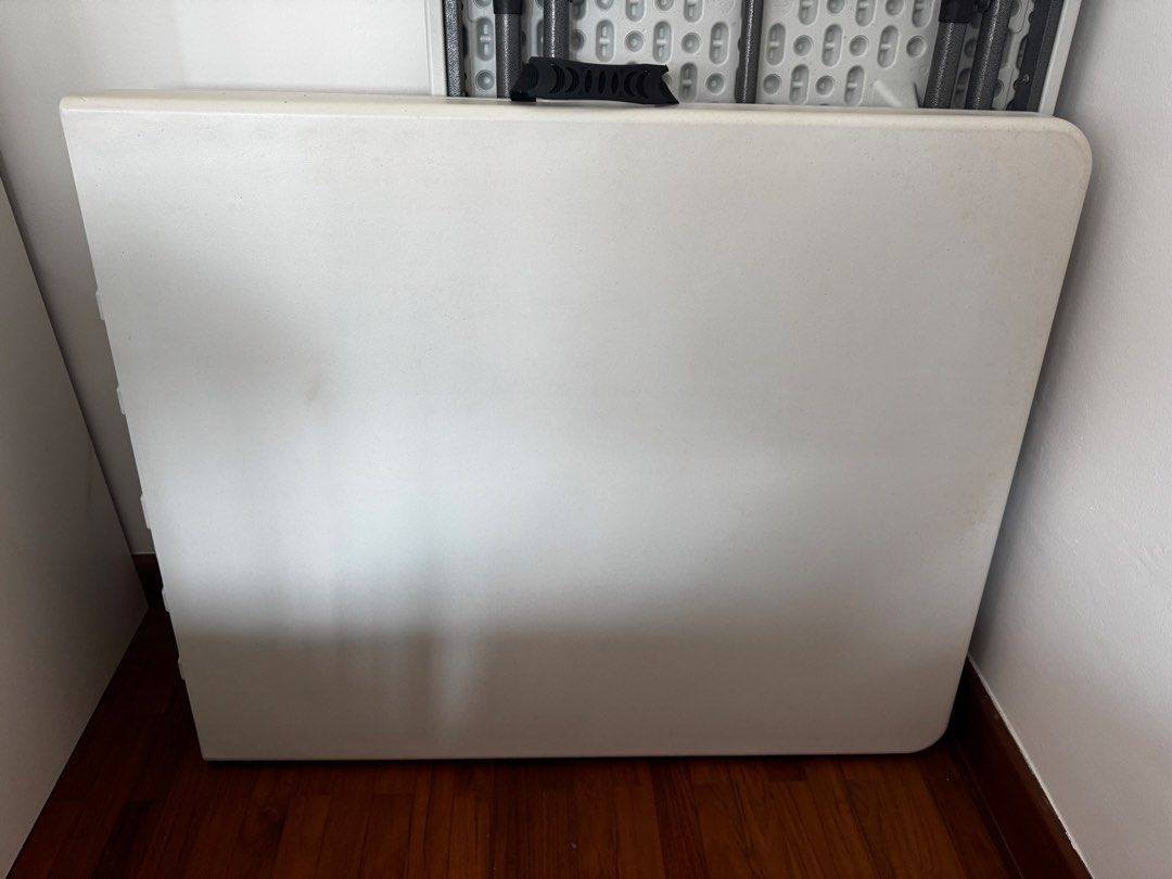 Folding Table (Category: Tables & Sets) located in Singapore. Submitted by ohsinchan (Listing ID 1453861876, Image 2). Description: - folding table - 1.5m when opened, 75cm when folded - Folds in half for easy storage and transport - Built-in handle for portability - Strong and stable design - Secure locking clasps.
