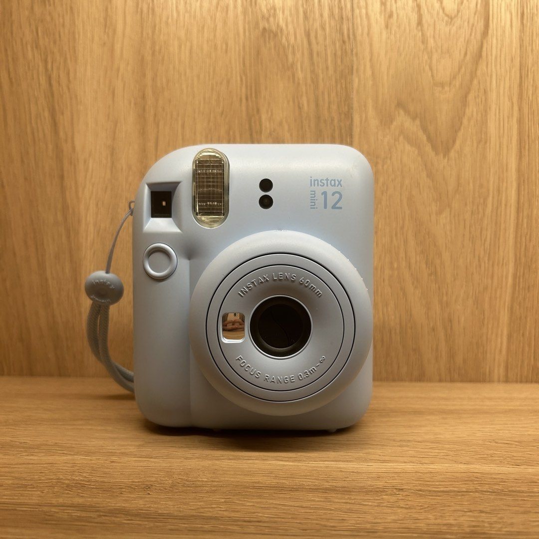 Fujifilm Instax Mini 12 Blue Camera with Case (Category: Cameras) located in Paranaque City. Submitted by lnce.e (Listing ID 1453925784, Image 2). Description: WORKING Used a few times only FILM NOT INCLUDED Includes camera case and free pouch w/ 2 AA batteries Parañaque Loc.