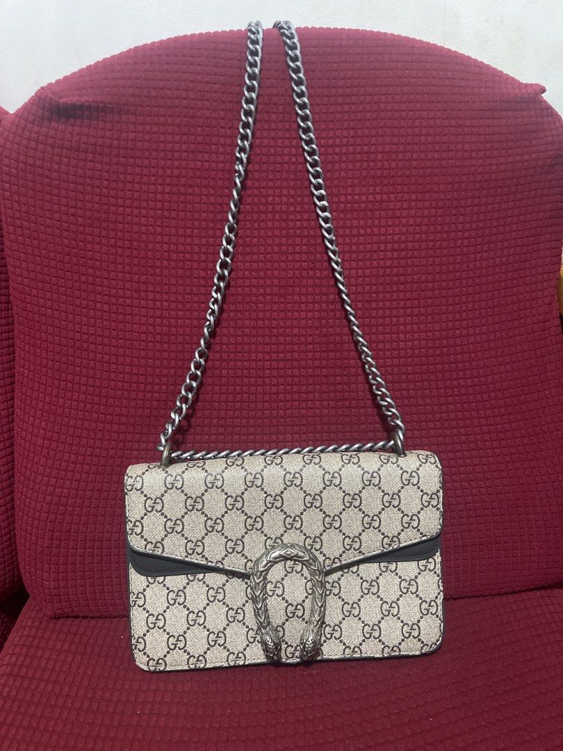 Gucci Dionysus GG Supreme Chain Bag (Category: Luxury Bags & Wallets) located in Davao. Submitted by rcgulanes.moon (Listing ID 1453946877, Image 1). Description: - Classic Gucci chain bag - Iconic GG Supreme canvas - Silver-tone Dionysus tiger head closure - Interior zip pocket and main compartment - Silver chain strap - Versatile for day or night use.