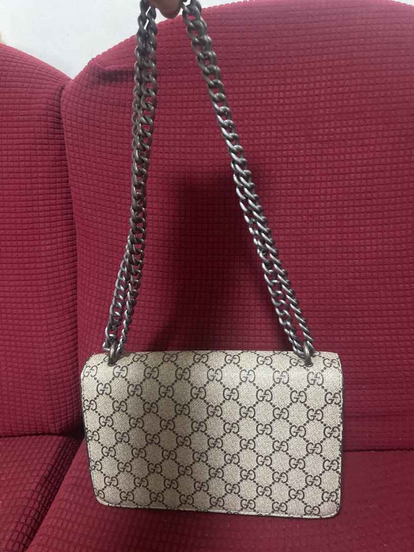 Gucci Dionysus GG Supreme Chain Bag (Category: Luxury Bags & Wallets) located in Davao. Submitted by rcgulanes.moon (Listing ID 1453946877, Image 2). Description: - Classic Gucci chain bag - Iconic GG Supreme canvas - Silver-tone Dionysus tiger head closure - Interior zip pocket and main compartment - Silver chain strap - Versatile for day or night use.