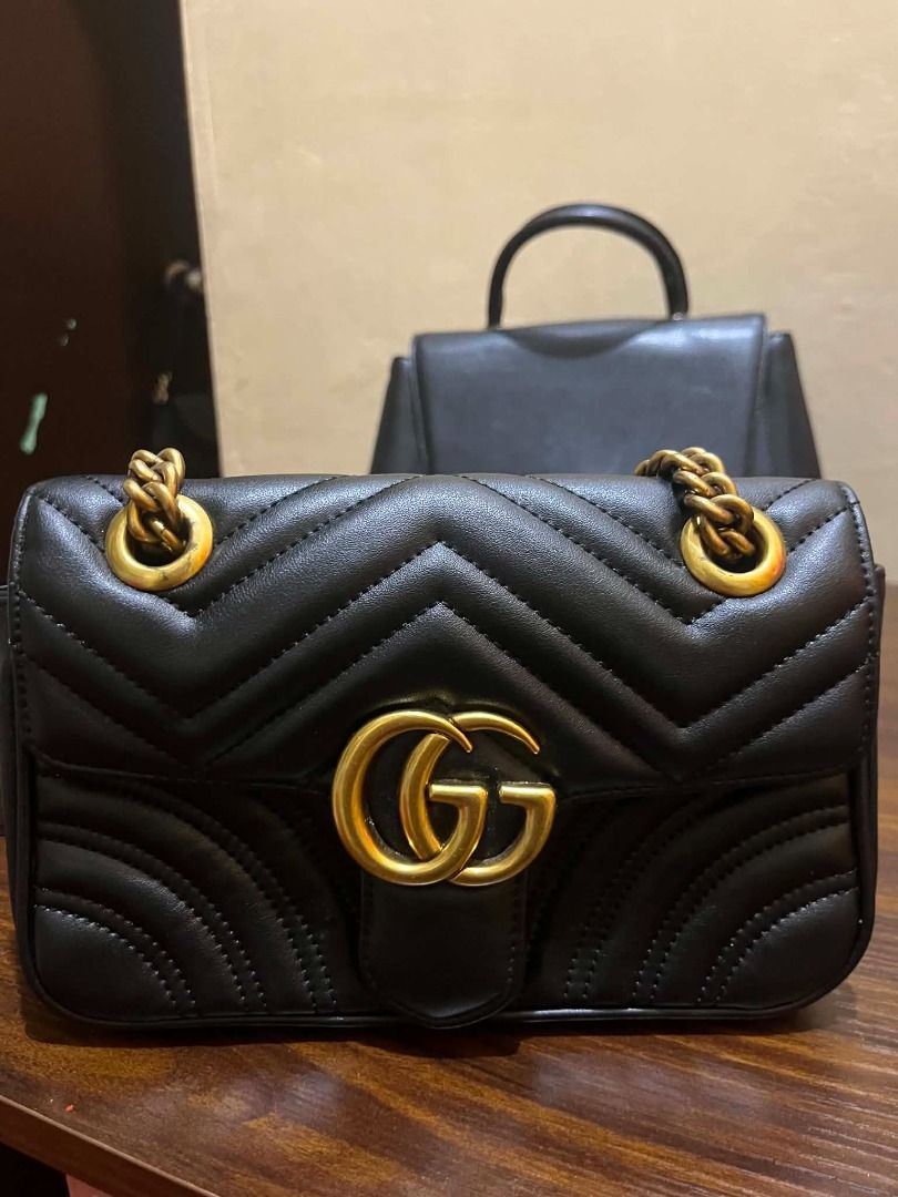 Gucci Marmont Small Shoulder Bag Black Leather (Category: Luxury Bags & Wallets) located in Manila. Submitted by mela020 (Listing ID 1453959869, Image 1). Description: - Authentic Gucci Marmont bag - Small size - Black quilted leather - Iconic gold GG hardware - Versatile chain strap - Ideal for evenings out or daily wear.