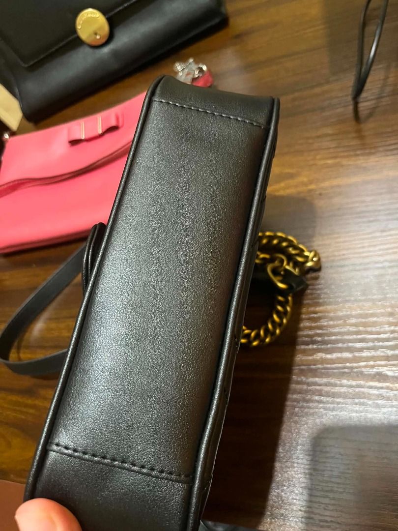 Gucci Marmont Small Shoulder Bag Black Leather (Category: Luxury Bags & Wallets) located in Manila. Submitted by mela020 (Listing ID 1453959869, Image 2). Description: - Authentic Gucci Marmont bag - Small size - Black quilted leather - Iconic gold GG hardware - Versatile chain strap - Ideal for evenings out or daily wear.