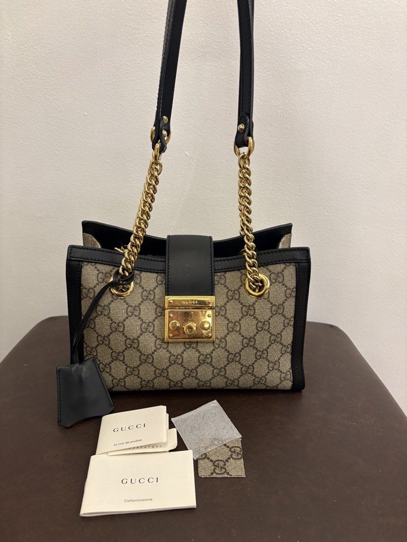 Gucci Padlock GG Supreme Canvas Shoulder Bag (Category: Luxury Bags & Wallets) located in Pasig City. Submitted by authentic_shopaholic_manila (Listing ID 1453858025, Image 2). Description: - Authentic Gucci shoulder bag - Iconic GG Supreme canvas - Black leather trim and strap - Gold-tone hardware with signature padlock closure - Chain strap for shoulder wear - Includes dust bag and authenticity cards - Perfect for everyday or special occasions 
