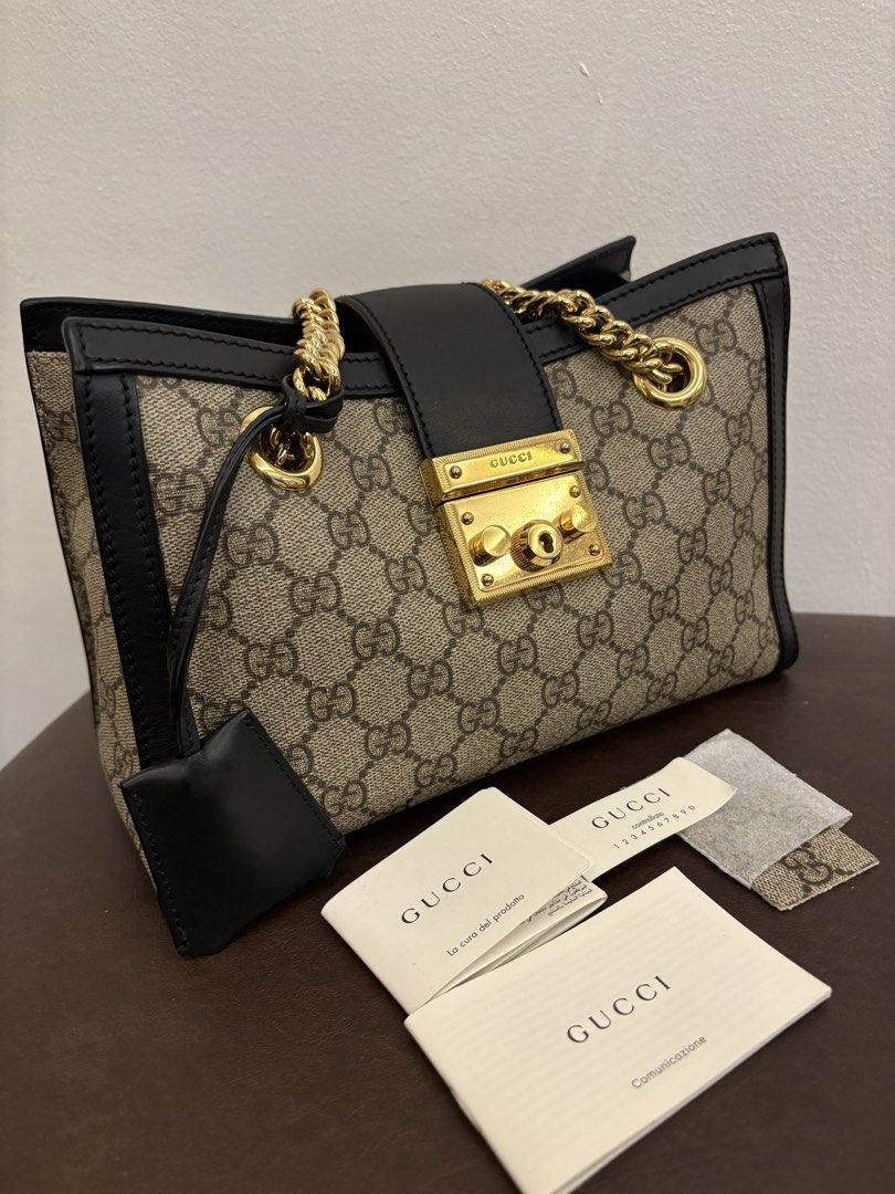 Gucci Padlock GG Supreme Canvas Shoulder Bag (Category: Luxury Bags & Wallets) located in Pasig City. Submitted by authentic_shopaholic_manila (Listing ID 1453858025, Image 3). Description: - Authentic Gucci shoulder bag - Iconic GG Supreme canvas - Black leather trim and strap - Gold-tone hardware with signature padlock closure - Chain strap for shoulder wear - Includes dust bag and authenticity cards - Perfect for everyday or special occasions 