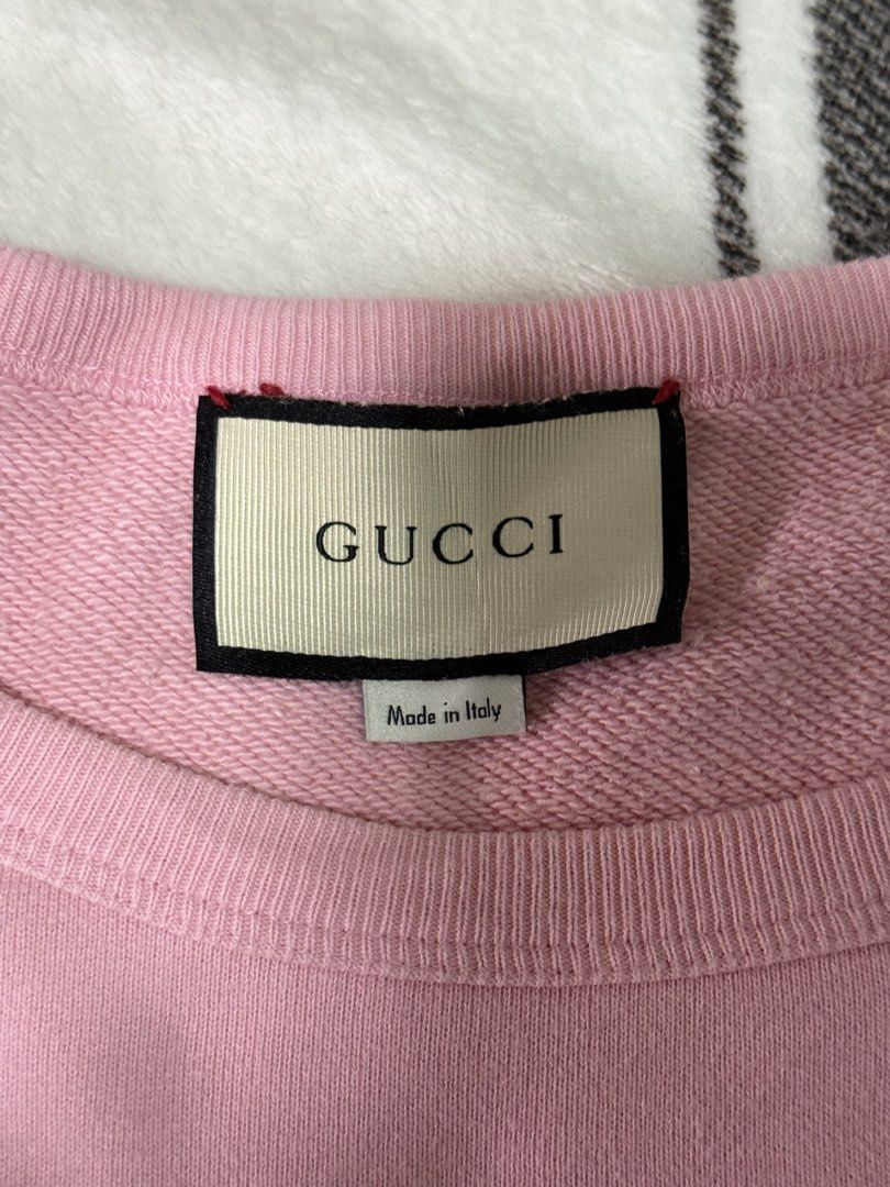Gucci Pink Sweatshirt with Pig Graphic (Category: Community) located in Bacoor. Submitted by giornoks (Listing ID 1453842625, Image 3). Description: - Authentic Pink Gucci Sweatshirt - Features iconic Gucci logo with a cute pig graphic - Ribbed cuffs and hem for a comfortable fit - Ideal for stylish casual wear -Unisex DIMES: WIDTH- 24 LENGTH- 28 .
