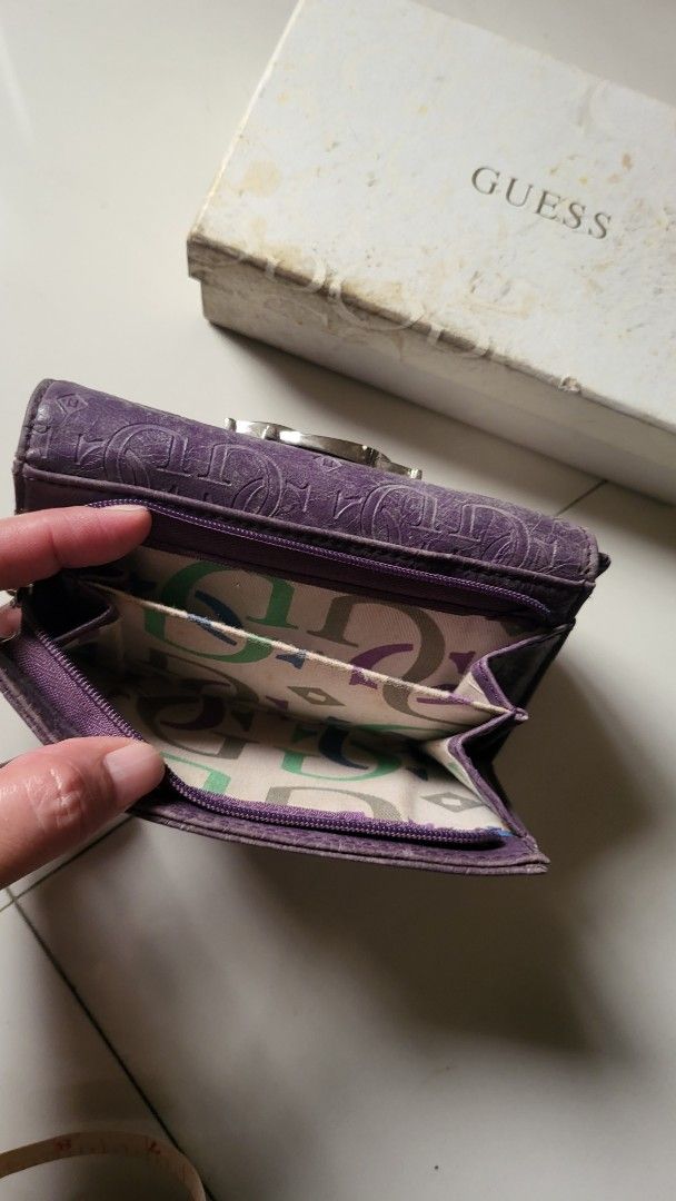 Guess Purple Medium Wallet for women (Category: Wallets & Card holders) located in Bulacan. Submitted by comkay (Listing ID 1453839234, Image 3). Description: Authentic and real leather material Only issue is a bit of tear on the 1st bill compartment and needs thorough cleaning. No cracks or damage on the leather except for usual wear and tear. .