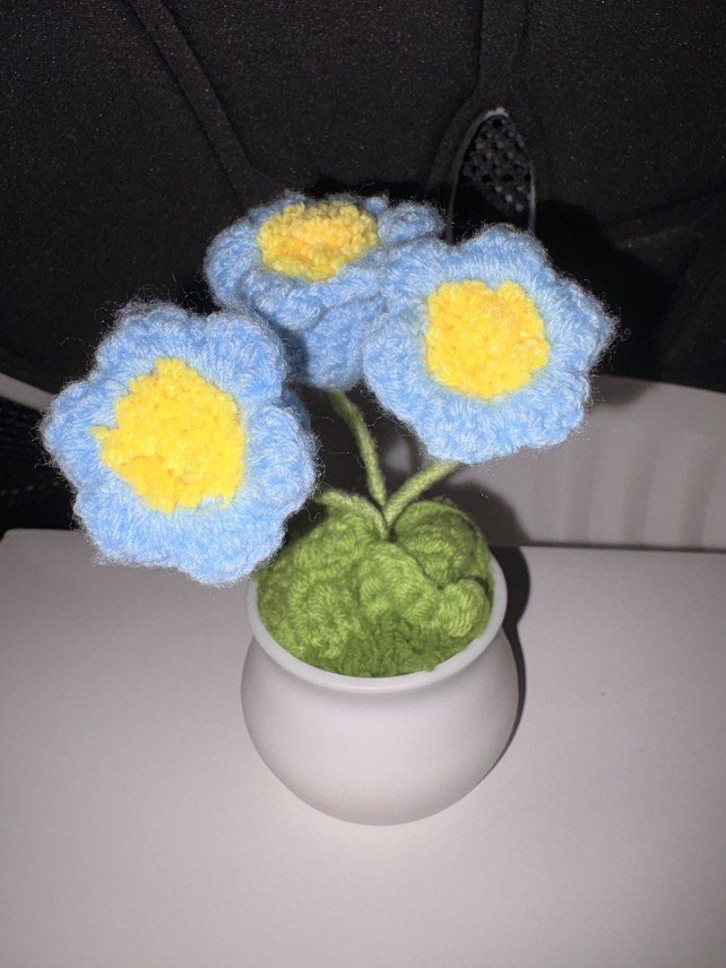 Handmade Crocheted Blue Flowers in Pot (Category: Handmade Craft) located in Quezon City. Submitted by maiamad (Listing ID 1453983481, Image 1). Description: - Attached in a small white pot - Ideal for gifting or personal treat No issue.