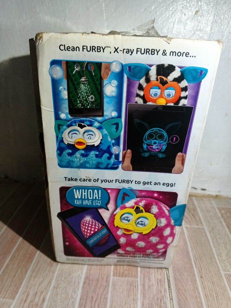 Hasbro Furby Boom! Interactive Toy - Blue (Category: Interactive Toys) located in Manila. Submitted by pogoniyar (Listing ID 1453921825, Image 2). Description: - Interactive Furby Boom toy in blue - Requires 4 AA batteries (not included) - Broken Poster and no sticker - has unknown leak (not battery leak since we check it and the battery compartment is empty) Need repair I don't know if battery ang problem or yung mismong toy na but pa check n'yo