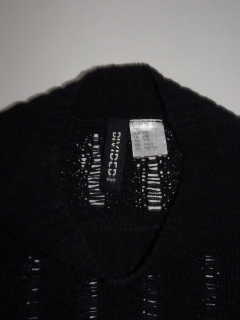 H&M Divided Black Mesh Knit Cropped Top (Category: Blouses) located in Manila. Submitted by kim.declutterss (Listing ID 1453953001, Image 3). Description: - Size: XXS (fits XXS-small) - Style: Cropped top - Color: Black - Features: Mesh knit texture, vertical stripes, mock neck - Sleeve Length: Short sleeves .