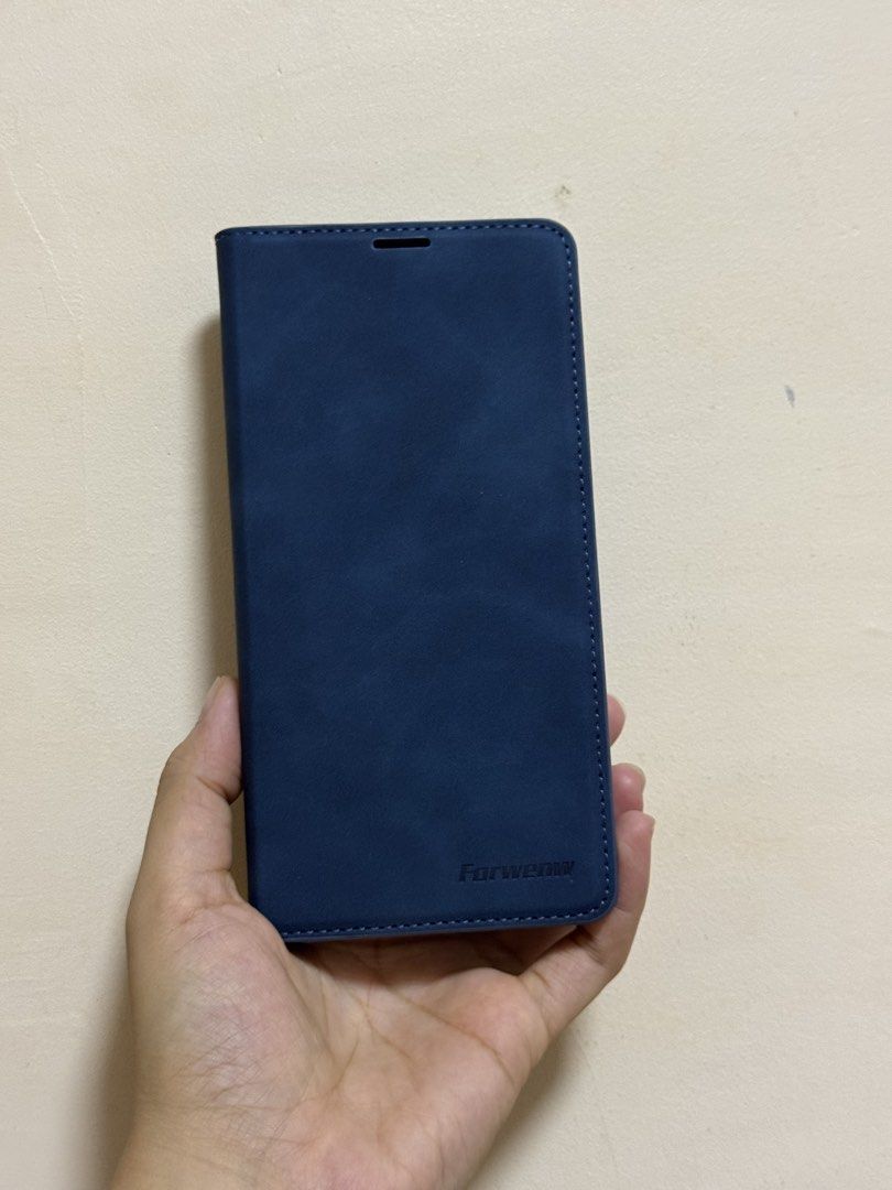 Iphone 15 (fifteen) Pro Max Blue Flip Case (Category: Cases & Sleeves) located in Manila. Submitted by averythingg (Listing ID 1453889244, Image 1). Description: Velvet blue texture. Durable and thick material. Never used. .
