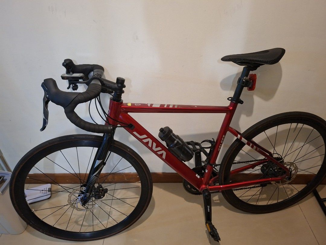 Java roadbike (Category: Bicycles) located in Singapore. Submitted by miyaplayer (Listing ID 1453925423, Image 2). Description: - Red JAVA Veloce road bike - Equipped with disc brakes - Comes with a water bottle cage and bottle - Ready to ride, perfect for cycling enthusiasts comes with speedomount n bottle cages. meroca wheelset(loud hubs) carbon 3d printed saddle selling with a heavy heart so pls dont lowball.
