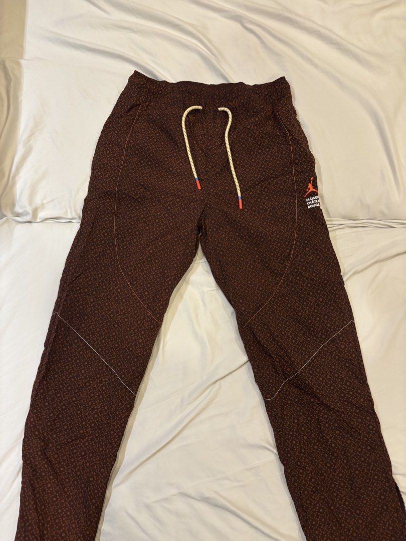 Jordan x Travis Scott "Cactus Jack" Brown Patterned Pants (Category: Joggers) located in Manila. Submitted by zxcvbnm_100 (Listing ID 1453974507, Image 1). Description: - Brown pants with a repeating pattern - Features Jordan Jumpman and Travis Scott Cactus Jack branding on the side - Elastic waistband with drawstring for adjustable fit - Size S - Made in Indonesia Bought in Jordan brand manila Original price 10k .