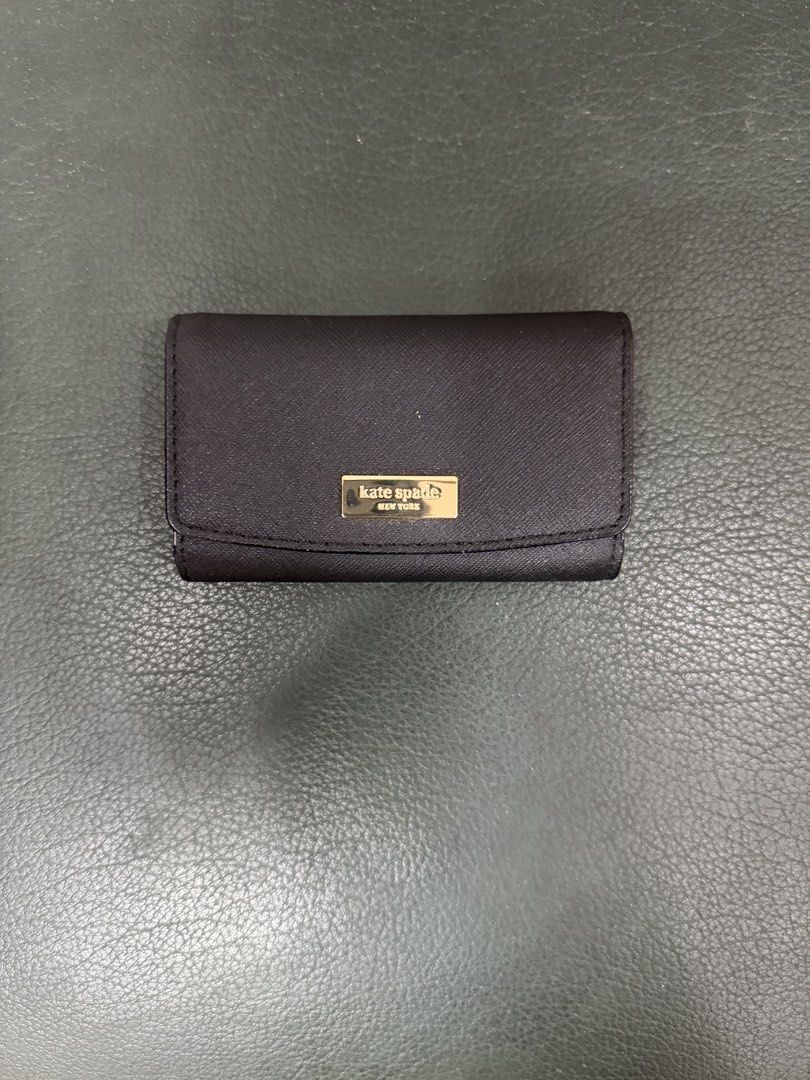 Kate Spade Black Saffiano Leather Key Holder (Category: Wallets & Card holders) located in Manila. Submitted by jay_bee888 (Listing ID 1453846520, Image 1). Description: - Authentic Kate Spade key holder - Black saffiano leather - 4 key hooks inside - Small slot for cards - Original tag still attached - Never use just store inside the cabinet - No more inclusion Loc: Binondo Manila, or Que City near Timog .