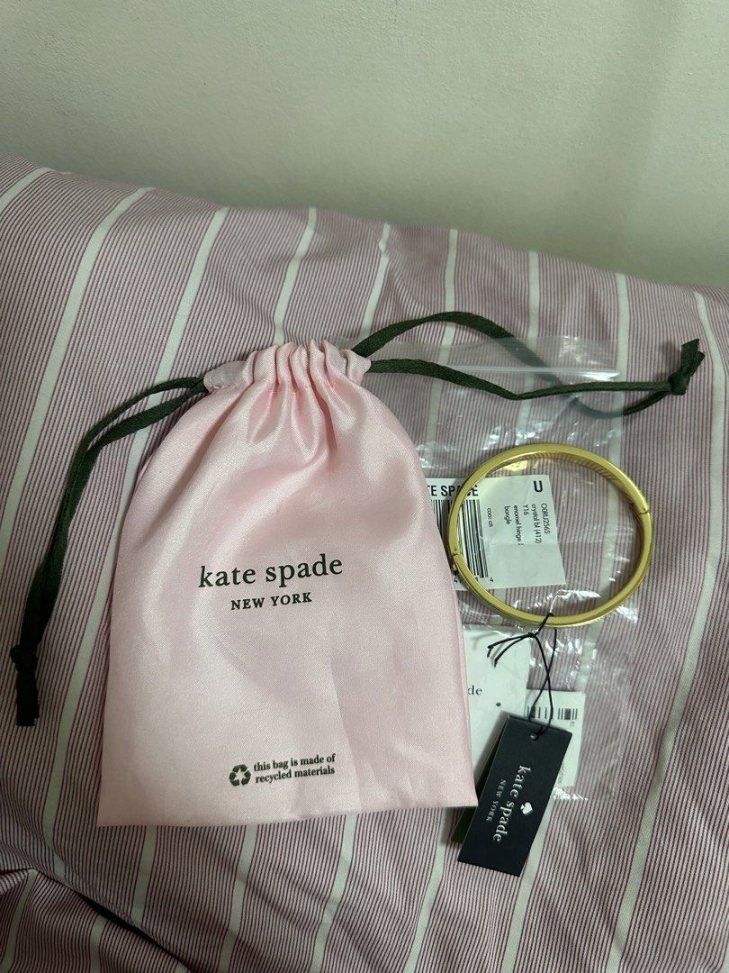 Kate Spade Mint Green Spade Bangle Bracelet (Nego) (Category: Luxury Accessories) located in Malabon City. Submitted by catlaina (Listing ID 1453928697, Image 2). Description: Mint Green with Gold tone Stamped gold spades on sides Comes with a Kate Spade Jewelry Pouch Purchased in Taiwam Negotiable price for sure buyer.