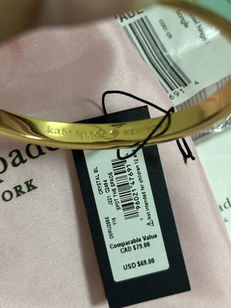 Kate Spade Mint Green Spade Bangle Bracelet (Nego) (Category: Luxury Accessories) located in Malabon City. Submitted by catlaina (Listing ID 1453928697, Image 3). Description: Mint Green with Gold tone Stamped gold spades on sides Comes with a Kate Spade Jewelry Pouch Purchased in Taiwam Negotiable price for sure buyer.
